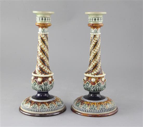 A pair of Doulton Lambeth stoneware candlesticks, height 30cm